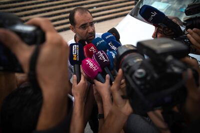 Soulaiman Raissouni, uncle of journalist Hajar Raissouni and editor in chief of Akhbar Al-Youm daily newspaper, speaks to the media after her sentencing. AP