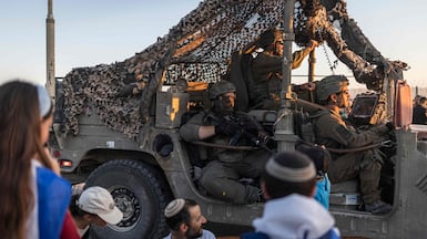 Israeli soldiers drive on the border with the Gaza Strip as right-wing activists gather in an attempt to cross over into the embattled territory on July 19, 2026.AFP