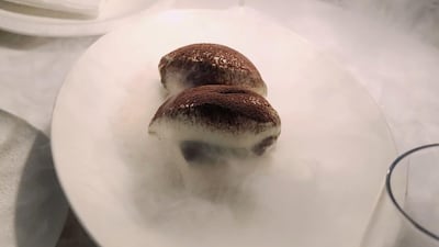 The so-called GTOAT (greatest tiramisu of all time) is served with dry ice for dramatic flair at Les Dangereux. Juman Jarallah / The National