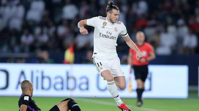 Gareth Bale of Real Madrid competes with Ismail Ahmed of Al Ain during the match between Real Madrid and Al Ain at the Fifa Club World Cup final at the Zayed Sports City Stadium, Abu Dhabi. Chris Whiteoak / The National