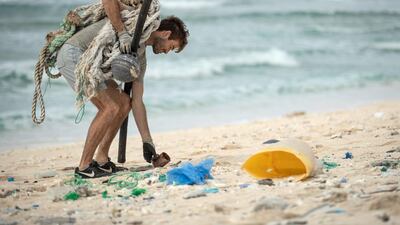 Johnny Briggs picks up rubbish on East beach. Iain McGregor/STUFF