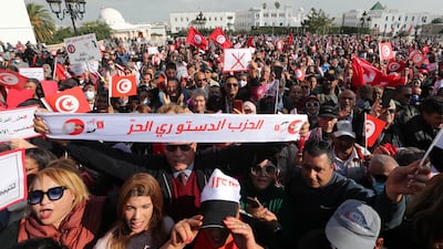 Supporters of Tunisia's Free Destourian Party take part in a protest demanding the dissolution of Parliament and asking for early legislative elections next to the government palace in Tunis. EPA