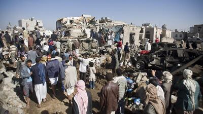 People search for survivors under the rubble of houses destroyed by Saudi airstrikes near Sanaa Airport. Hani Mohammed / AP Photo