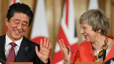 Mrs May with Japanese PM Shinzo Abe. AP
