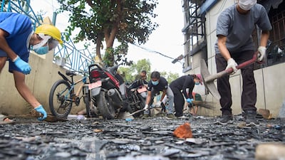 Volunteers clear debris at a police station that was vandalised during anti-corruption protests in Kathmandu, Nepal. AP Photo