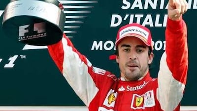 Fernando Alonso celebrates his win at Monza.