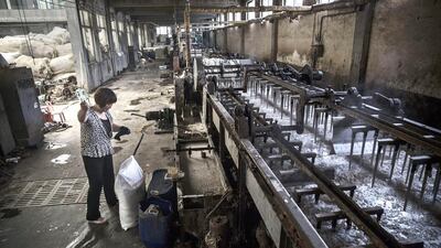 About half of China's wool imports from Australia are processed and re-exported to Europe, America and Japan. Kevin Frayer / Getty Images