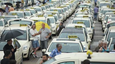 Taxi drivers gather next to the Olympia Stadium in Berlin, Germany to protest ride-sharing apps Wundercar and Uber. Sean Gallup / Getty Images