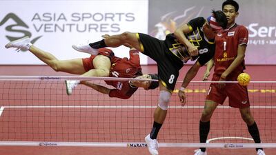Thailand’s Anuwat Chaichana (L) and Malaysia’s Khairol Zaman in action during their mens final match. Asia Sports Ventures / Action Images via Reuters