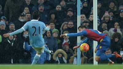 David Silva of Manchester City scores the team’s fourth goal on Saturday in their 4-0 Premier League win at the Etihad Stadium. Oli Scarff / AFP