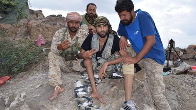 Yemenis Fadhel Al Sawlani, right, and Saleh Ahmed Naser, do not let a disability get in the way of fighting on the front line. Courtesy: Ali Mahmood Mohamed