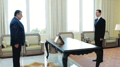 This photo of Mr Samir Al Sheikh and Syrian President Bashar Al Assad, taken on July 25, 2011, was included in the criminal complaint against Mr Al Sheikh. Photo was originally taken by Al Bayan news agency.