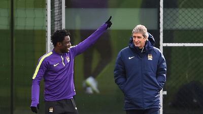 Wilfried Bony, left, alongside Manchester City manager Manuel Pellegrini. Laurence Griffiths / Getty Images