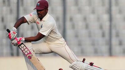 Darren Sammy plays a shot on his way to making his first international Test century against Bangladesh.
