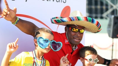 Waisale Serevi enjoyed having his photo taken with young rugby fans at the HSBC Rugby Festival Dubai on Friday, January 22, 2016, in Dubai. DELORES JOHNSON / The National