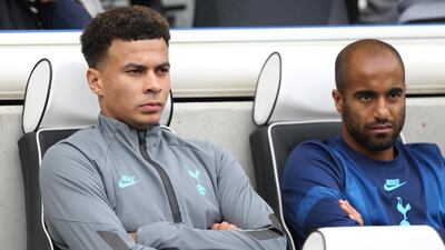 Tottenham Hotspur midfielder Dele Alli, left, on the bench during their Premier League defeat to Brighton on Saturday, October 5. EPA