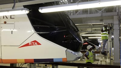 Workers in the maintenance building for the Dubai Tram. Jeffrey E Biteng / The National