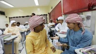 Mana Khalid, right, with a friend on the first day of classes at Mohammed bin Rashid Model School.