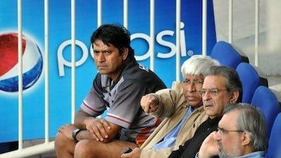 The UAE coach Aaqib Javed, far left, sits with officials of Emirates Cricket Board.