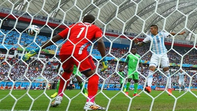 Marcos Rojo of Argentina scores his team's third goal past Vincent Enyeama of Nigeria during their match on Wednesday at the 2014 World Cup. Jeff Gross / Getty Images