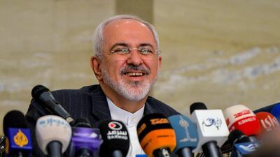 Iranian Foreign Minister Mohammad Javad Zarif smiles during a press conference.