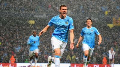 Edin Dzeko of Manchester City celebrates scoring the first of four goals that the hosts scored against Aston Villa at the Etihad Stadium. Michael Regan / Getty Images