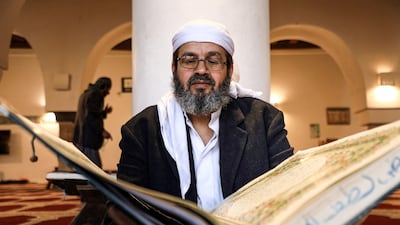 A man reads from a large version of the holy Quran at the Great Mosque of Sana'a, Yemen, ahead of Ramadan. AFP