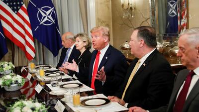 Donald Trump gestures as he and US secretary of defence James Mattis, US secretary of state Mike Pompeo attend a bilateral breakfast with Nato's Jens Stoltenberg. Reuters