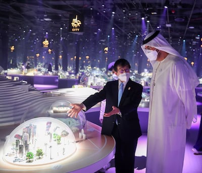 Dr Sultan Al Jaber is shown visions of future cities in the Japan pavilion at Expo 2020 Dubai. Photo: Ministry of Industry and Advanced Technology