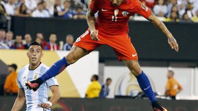 Chile’s Eduardo Vargas in action in front of Argentina’s Ramiro Funes Mori during extra time. (EPA/Jason Szenes)