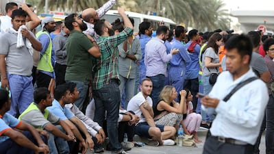 Crowds of people gathered on the streets around the tower, the 23rd tallest building in Dubai and 127th tallest in the world.