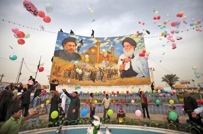 The square of Al Sadreen (the two Sadrs) in Baghdad in March 2010. Ayatollah Mohammad Baqer Al Sadr, depicted left, an uncle of Moqtada Al Sadr, was an eminent Shiite thinker, although Moqtada's father, Ayatollah Mohammad Sadeq, was less of an intellectual figure. Both were killed during during Saddam Hussein's rule. Their lives were marked by resistance to Saddam and the Baathist dictatorship. AP