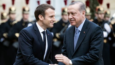 Turkish President Recep Tayyip Erdogan (R) is welcomed by French President Emmanuel Macron (L) upon his arrival at the Elysee Palace for a meeting in Paris, France, 05 January 2018. Erdogan is in Paris for a one-day visit for bilateral talks. EPA/ETIENNE LAURENT