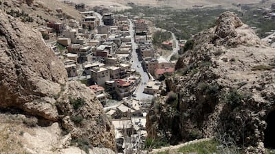 Residents have fled the ancient Christian town of Maalula, the last place on Earth where Aramaic is spoken, leading to fears the language spoken by Jesus will be lost for ever. Louai Beshara / AFP