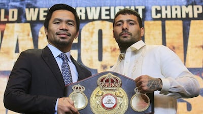 Manny Pacquiao, left, poses for a picture with welterweight world title holder Lucas Matthysse in a hotel in Paranaque city, metro Manila, Philippines. Romeo Ranoco / Reuters