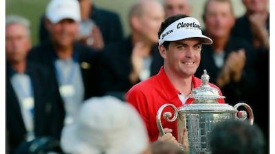 Keegan Bradley holds the Wanamaker Trophy after winning a three-hole play-off over Jason Dufner on Sunday. Kevin C Cox / AFP
