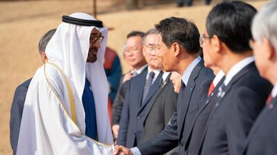 Sheikh Mohamed bin Zayed greets a member of the Korean delegation during a reception, at the Blue House. Ryan Carter / Ministry of Presidential Affairs