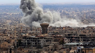 A general view taken from Damascus shows smoke rising from the rebel-held enclave of Eastern Ghouta following fresh air strikes and rocket fire on February 27. AFP