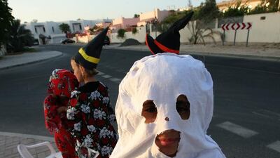 Children dress in witch and ghost Halloween costumes in Dubai. Paulo Vecina / The National