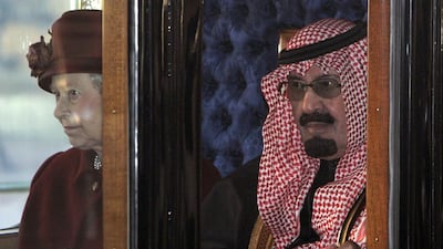 Britain’s Queen Elizabeth arrives at Buckingham Palace with Saudi Arabia’s King Abdullah after a state carriage procession along the Mall in London on October 30, 2007 file photo. Luke MacGregor / Reuters