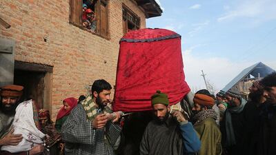 A bride being carried in a palanquin at Sanganwari village.