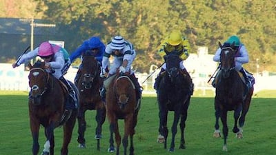 Frankel, left, ridden by Tom Queally wins the Queen Elizabeth II Stakes at Ascot.