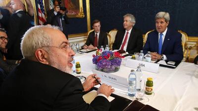 Iran's Foreign Minister Javad Zarif, left, holds a bilateral meeting with US Secretary of State John Kerry, right, on the second day of talks over Tehran's nuclear program in Vienna on July 14, 2014. Jim Bourg/Reuters