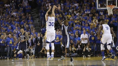 Golden State Warriors guard Stephen Curry (30) shoots a three point basket against Memphis Grizzlies forward JaMychal Green during the first half of an NBA basketball game in Oakland, California, Wednesday, April 13, 2016. (AP Photo/Marcio Jose Sanchez)