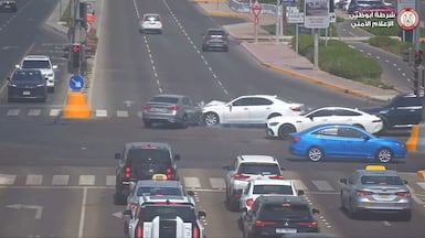 A careless driver causes an accident by using their phone behind the wheel. Photo: Abu Dhabi Police