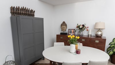 A grey bar cabinet from a couple who retired in Germany