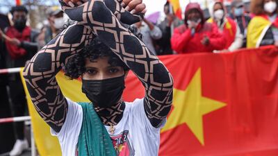A protester kneels during a demonstration against Ethiopia's war in Tigray. The US Senate resolution calls for the immediate cessation of hostilities in the region. Getty Images