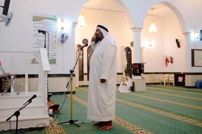 Ahmed Al Hashemi performs the call to prayer at Sheikh Rashid bin Saeed Al Maktoum Mosque in Hatta. Antonie Robertson / The National