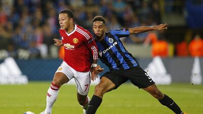 Manchester United's Memphis Depay drives past Club Brugge's Jean Charles Castelletto during their Champions League contest on Wednesday in Belgium. Carl Recine / Action Images / Reuters