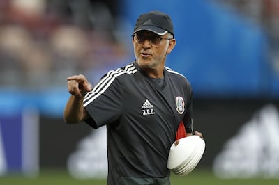 Mexico head coach Juan Carlos Osorio gives instructions to his players during Mexico's official training on the eve of the Group F match against Germany and Mexico at the Luzhniki Stadium in Moscow. Eduardo Verdugo / AP Photo